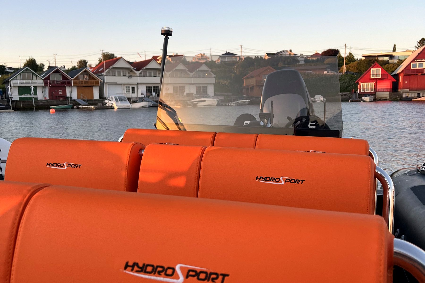 Painted boathouses seen from the water